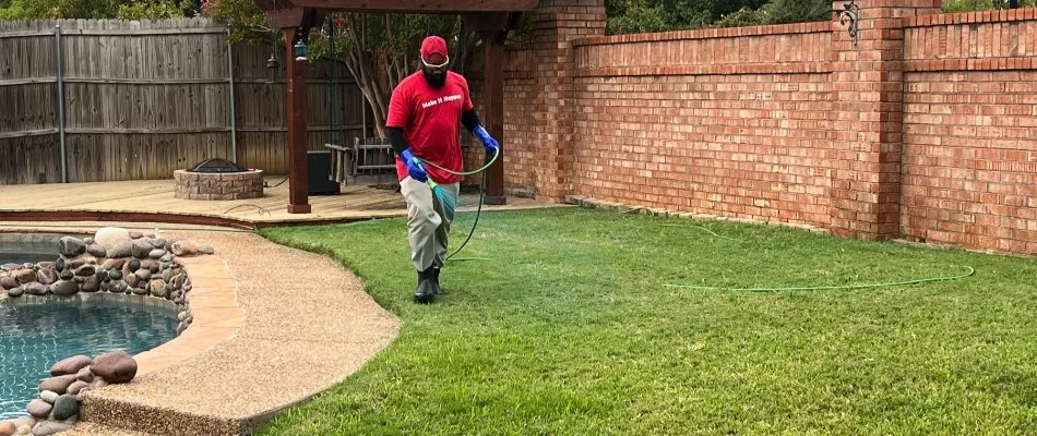 A professional spraying a lawn in Richland Hills, TX.